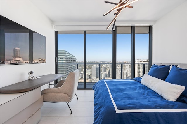 bedroom with expansive windows, access to outside, and tile patterned flooring