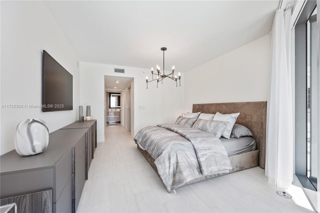 bedroom featuring a chandelier