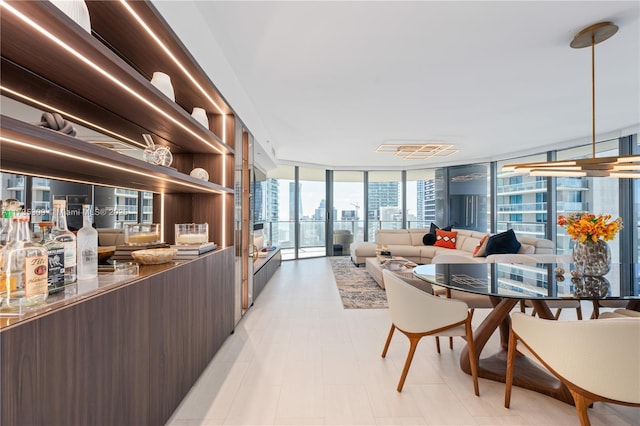 interior space with floor to ceiling windows and dark brown cabinets