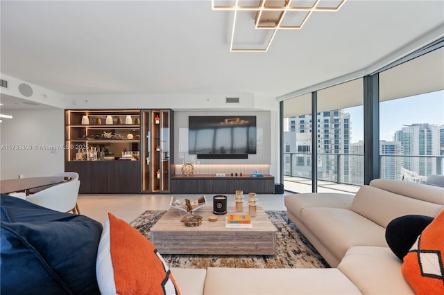 living room featuring a wall of windows and built in features