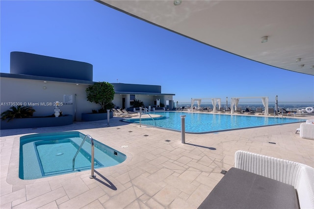 view of swimming pool with a patio area