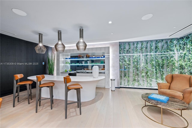 kitchen featuring a center island and light hardwood / wood-style flooring