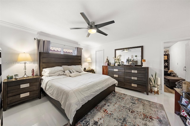 tiled bedroom featuring ornamental molding and ceiling fan