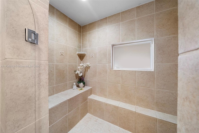 bathroom featuring tiled shower