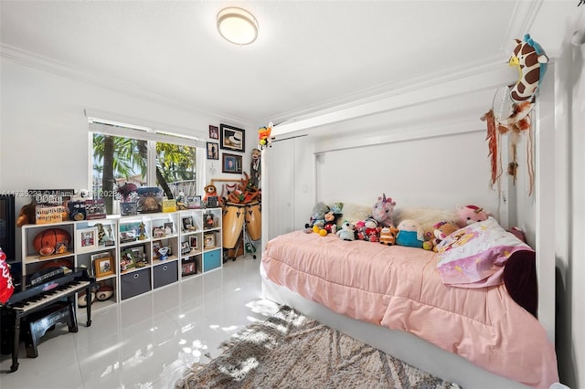 bedroom with ornamental molding, a closet, and light tile patterned floors