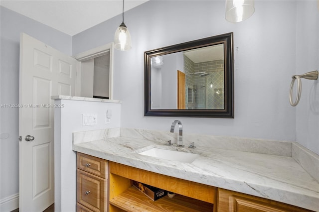 bathroom with vanity and a shower