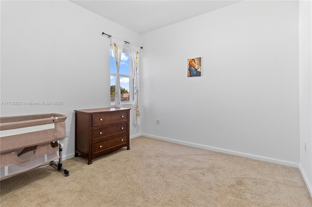 bedroom featuring light carpet