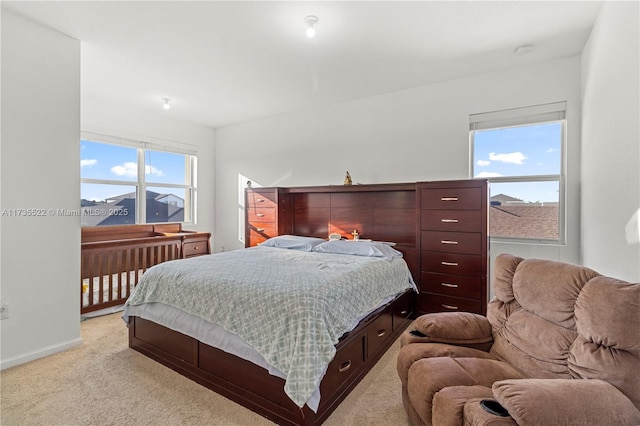 bedroom with light carpet