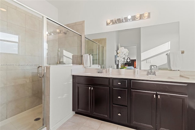 bathroom featuring vanity, an enclosed shower, and tile patterned floors