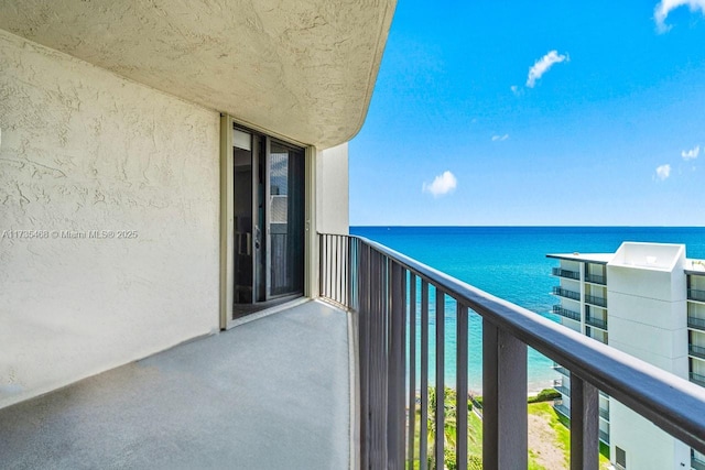 balcony featuring a water view