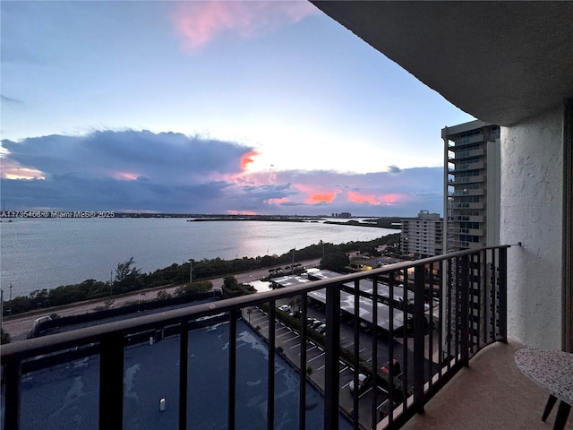 balcony at dusk with a water view