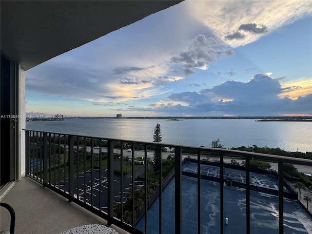balcony at dusk with a water view