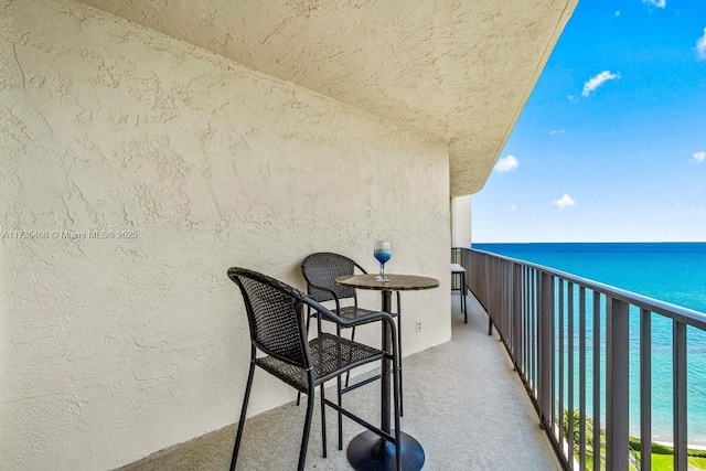 balcony featuring a water view