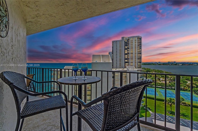 balcony featuring a water view