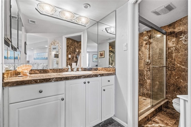 5420 N Ocean Dr Unit 1106, Singer Island, FL 33404 - bathroom with a stall shower, vanity, ensuite bath, and marble finish flooring