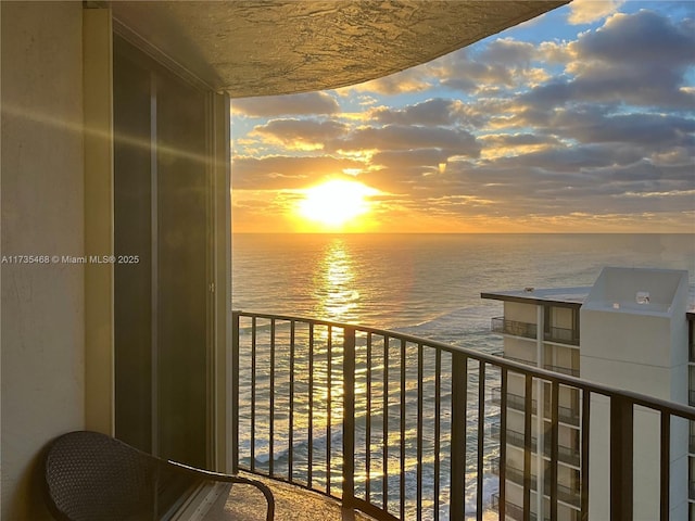 balcony at dusk with a water view