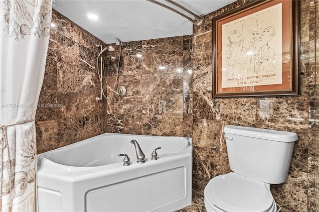 bathroom featuring toilet, shower / bath combo, and tile walls