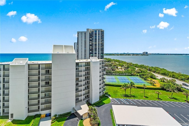 birds eye view of property with a water view