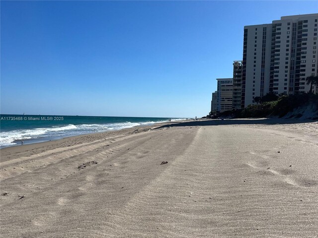 property view of water featuring a view of the beach