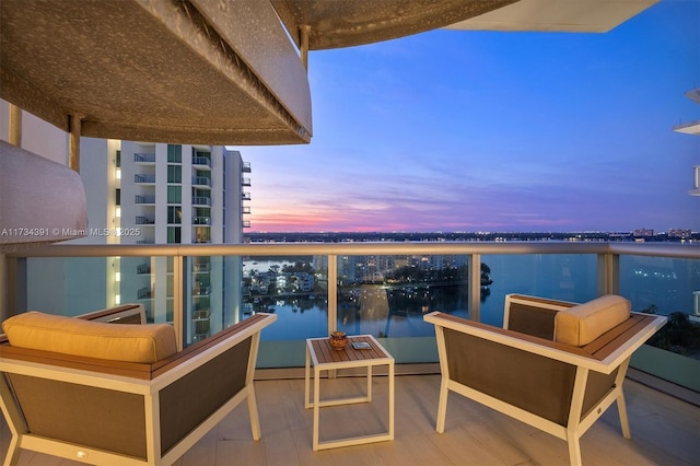 balcony featuring a water view