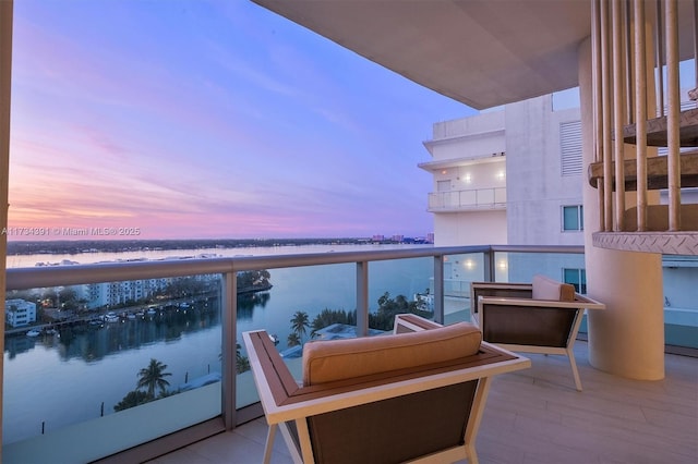 balcony featuring a water view