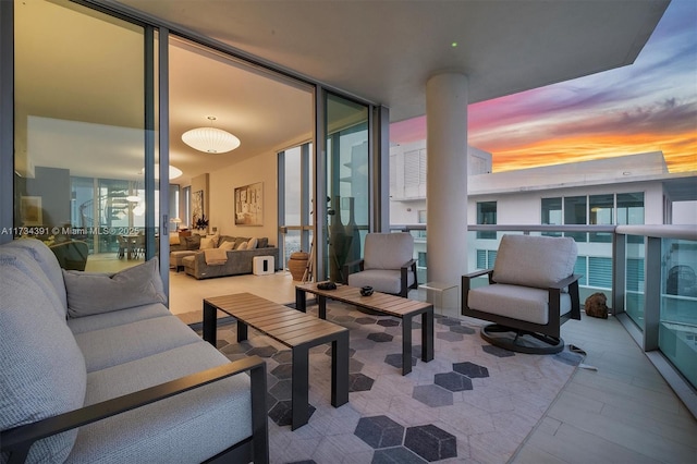 view of patio featuring an outdoor hangout area and a balcony