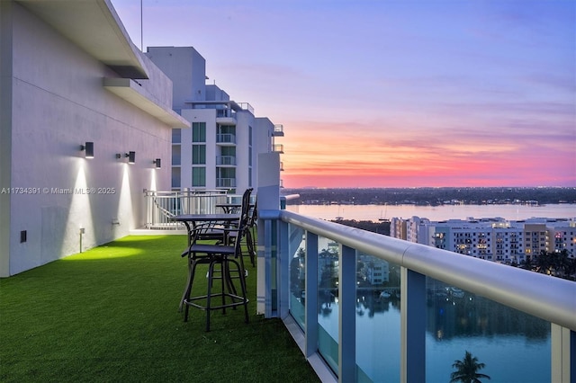 balcony at dusk with a water view