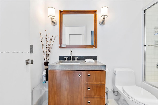 full bathroom with a shower with shower door, toilet, and vanity