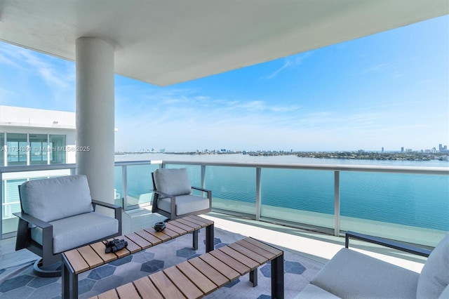 balcony featuring a water view