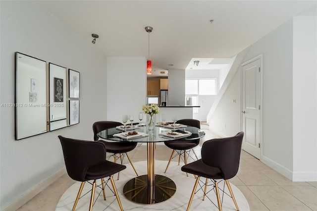 dining area with light tile patterned flooring