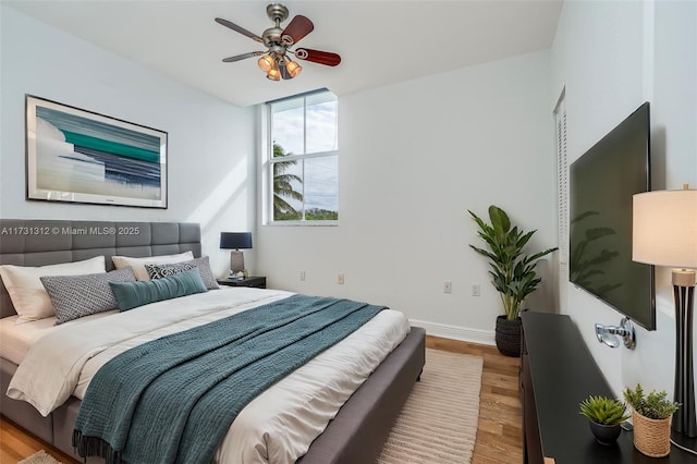 bedroom featuring ceiling fan and wood-type flooring