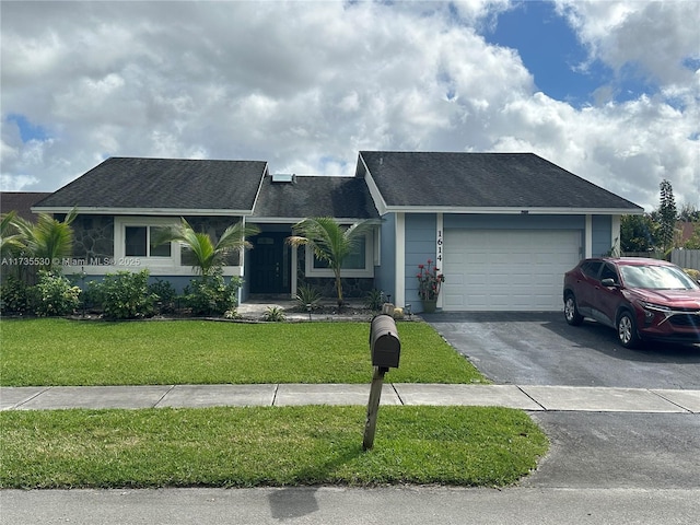 single story home with a garage and a front yard