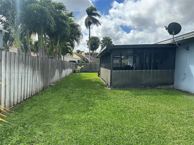 view of yard featuring a sunroom