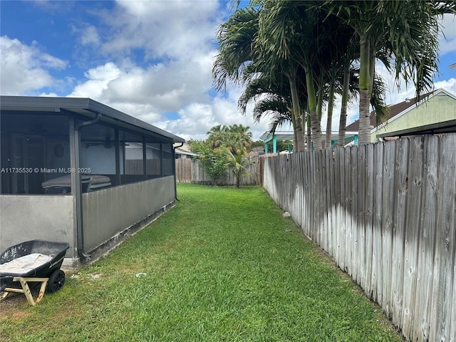 view of yard featuring a sunroom