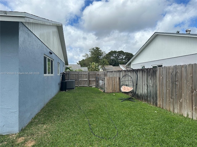 view of yard with central AC unit