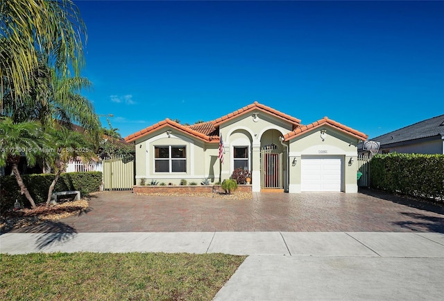 mediterranean / spanish-style home featuring a garage