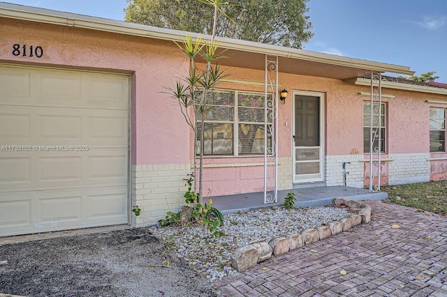 property entrance featuring a garage