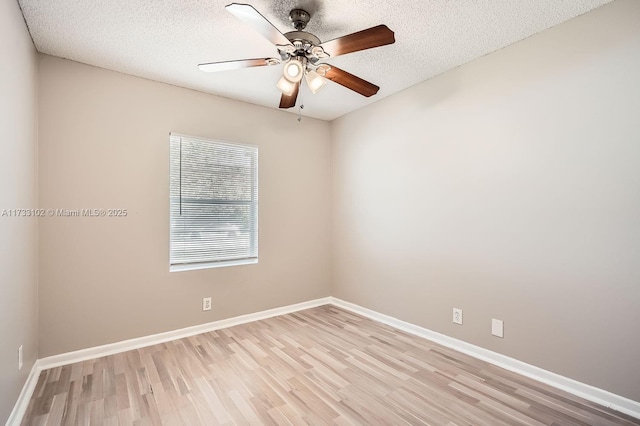 unfurnished room featuring ceiling fan, light hardwood / wood-style flooring, and a textured ceiling