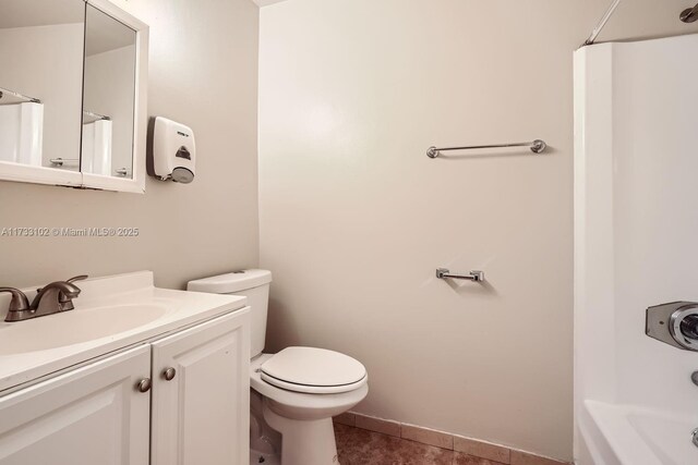 bathroom with tile patterned floors, vanity, toilet, and a shower with shower curtain