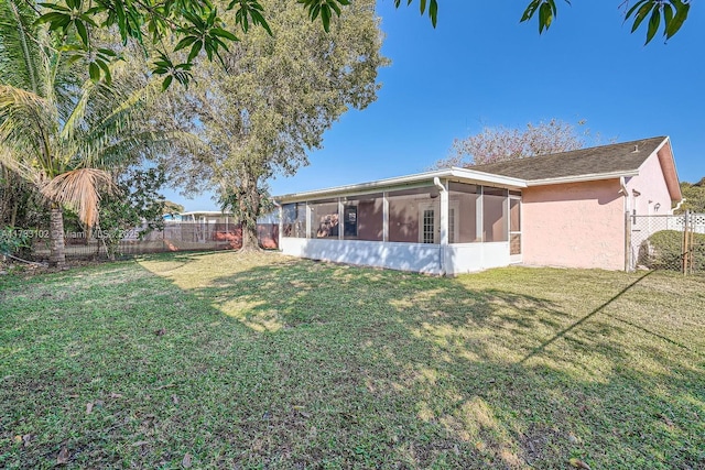 view of yard with a sunroom
