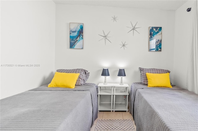 bedroom featuring light tile patterned floors