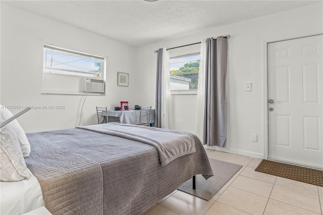 tiled bedroom with a textured ceiling