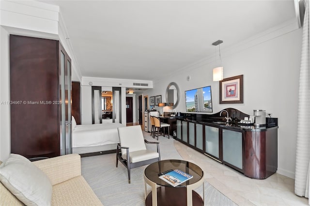 living room with ornamental molding and sink