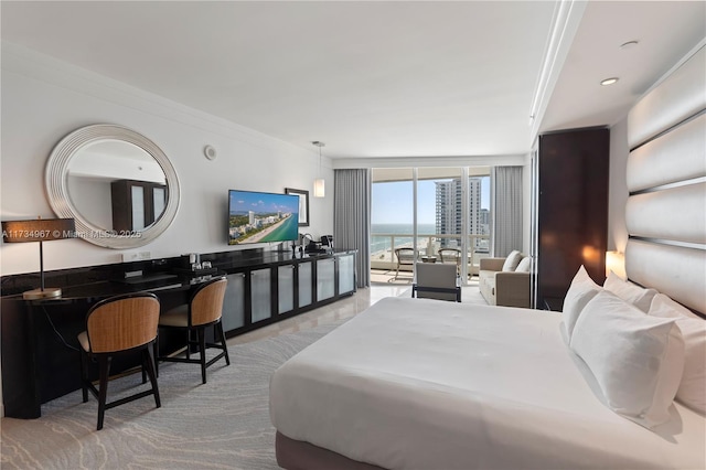 bedroom featuring ornamental molding, expansive windows, and access to outside