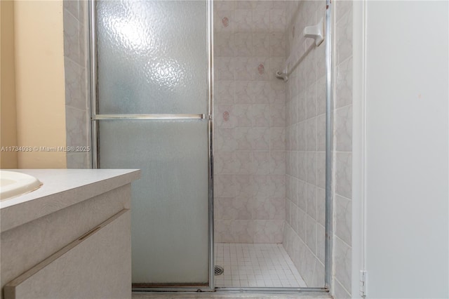 bathroom featuring a shower with shower door