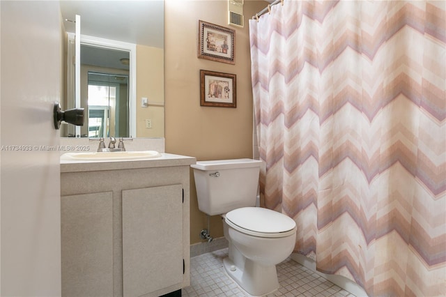 bathroom featuring vanity, tile patterned flooring, a shower with curtain, and toilet