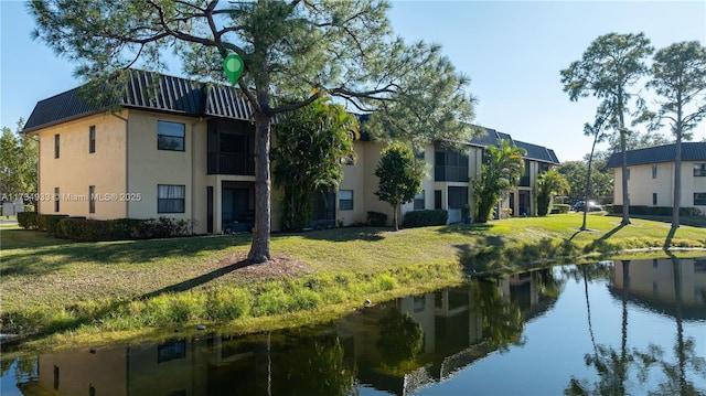 view of building exterior with a water view