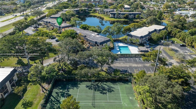 birds eye view of property with a water view