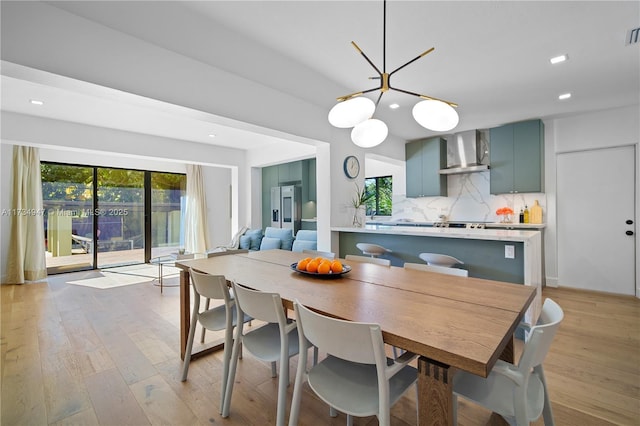 dining space with light wood-type flooring