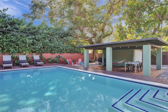 view of pool featuring a wooden deck